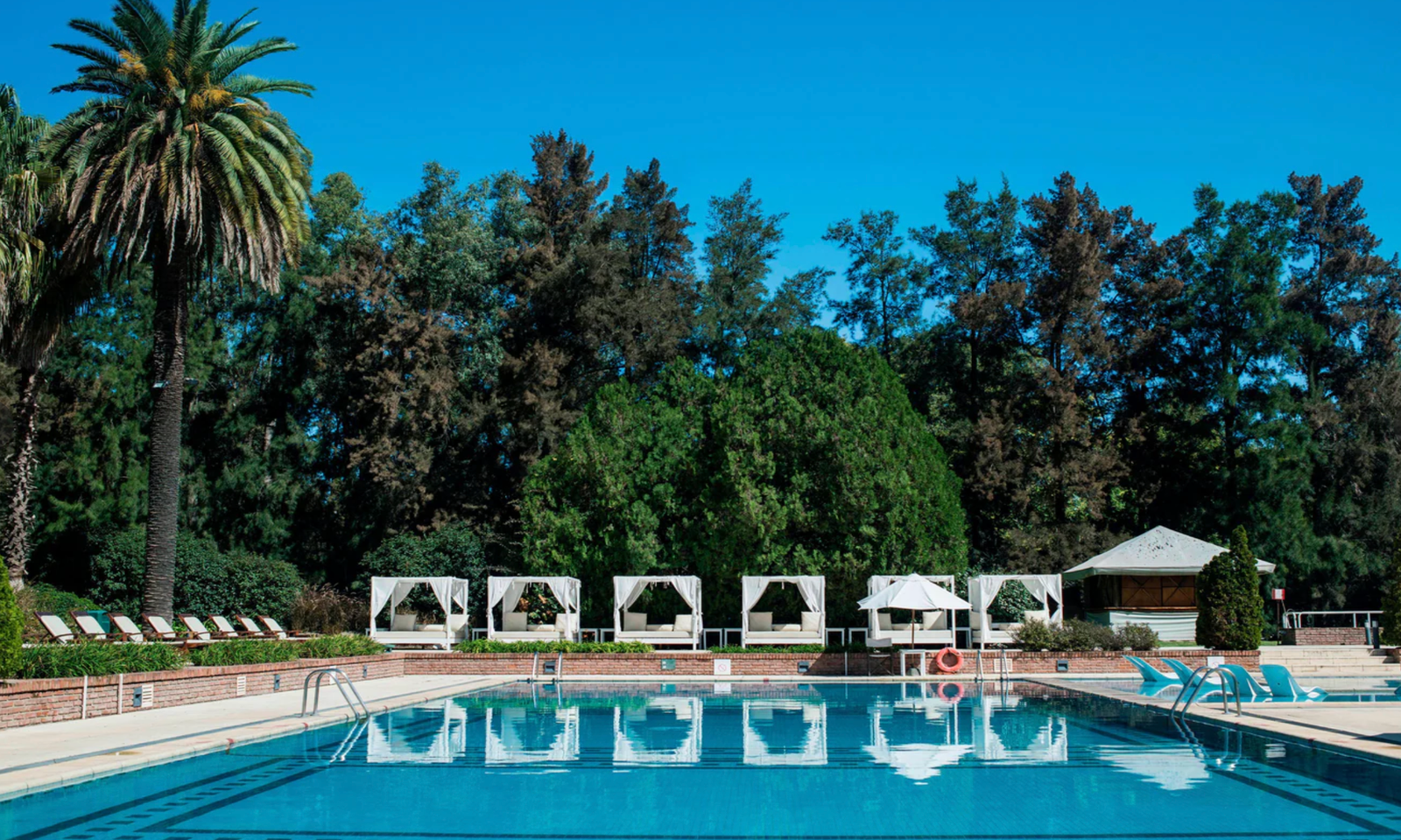 Sheraton Pilar outdoor pool with cabanas and lush gardens, Buenos Aires Argentina