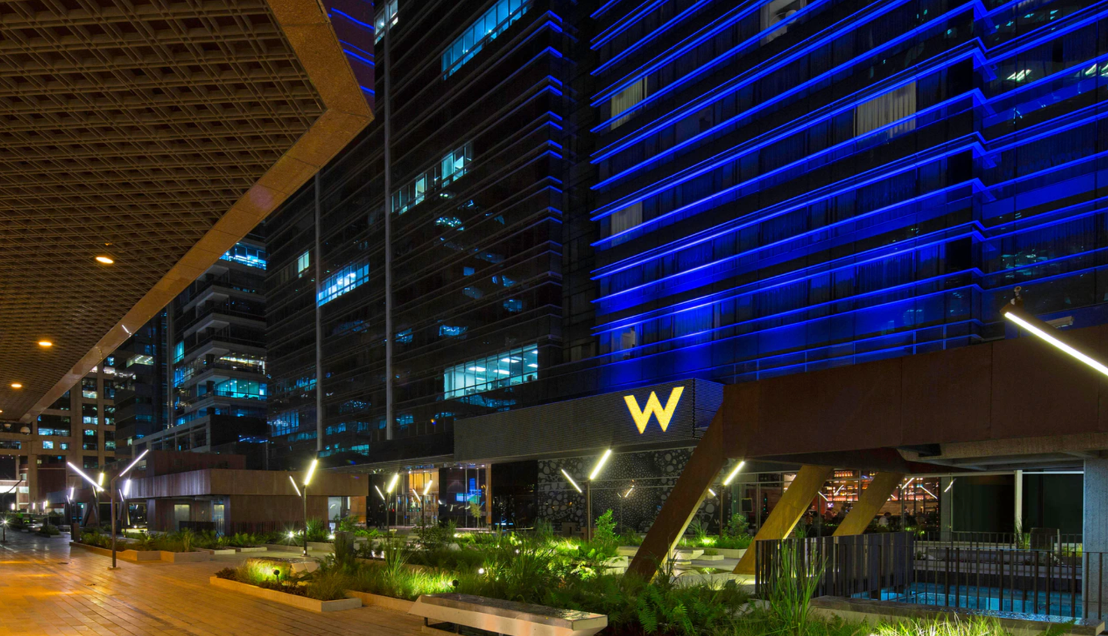 W Bogotá hotel exterior at night with blue LED lighting, Colombia