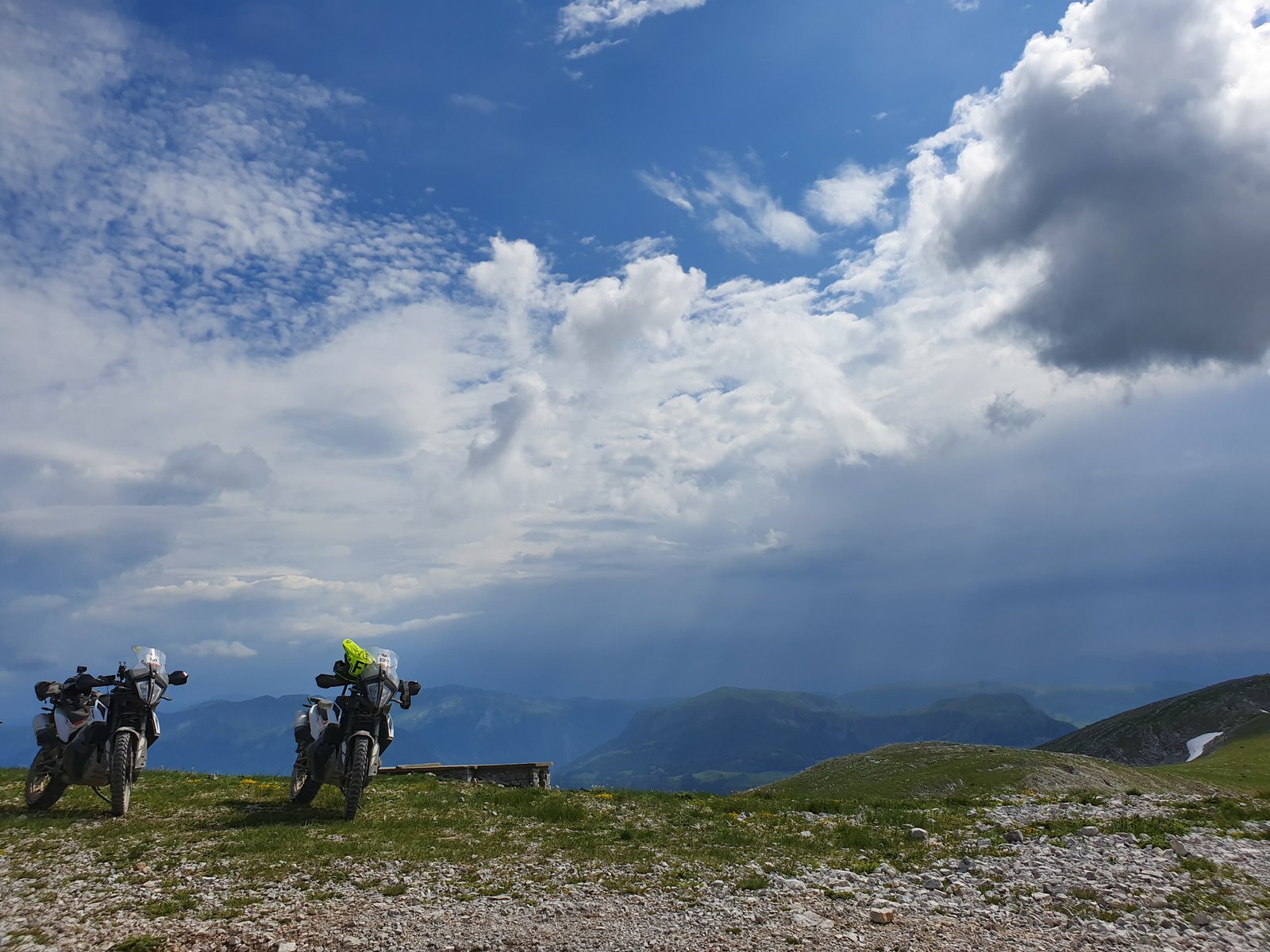 KTM Adventure Rally Bosnia 2019 — bikes on mountain plateau with clouds