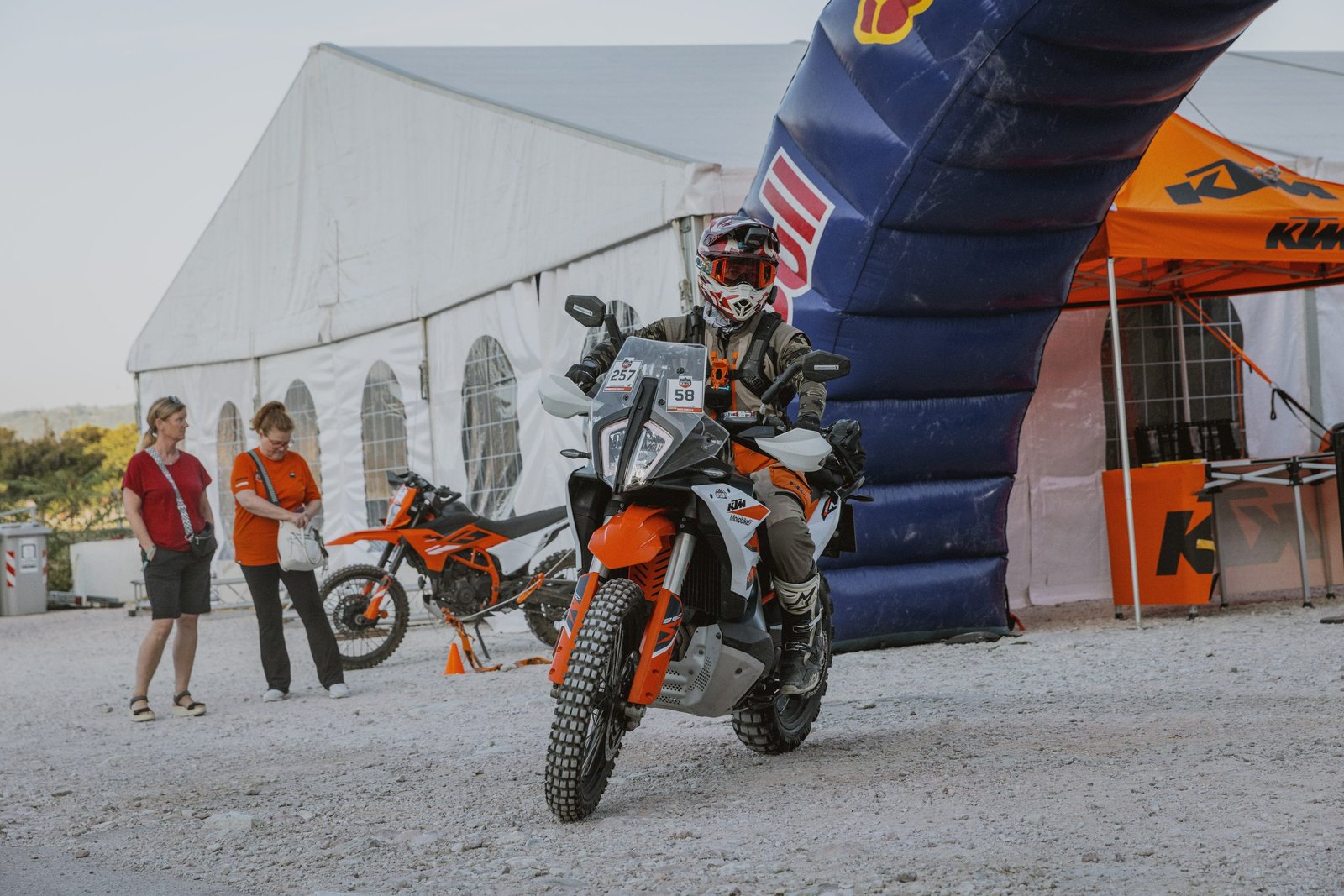 Rider leaving camp through the Red Bull arch on Day 1, Gubbio