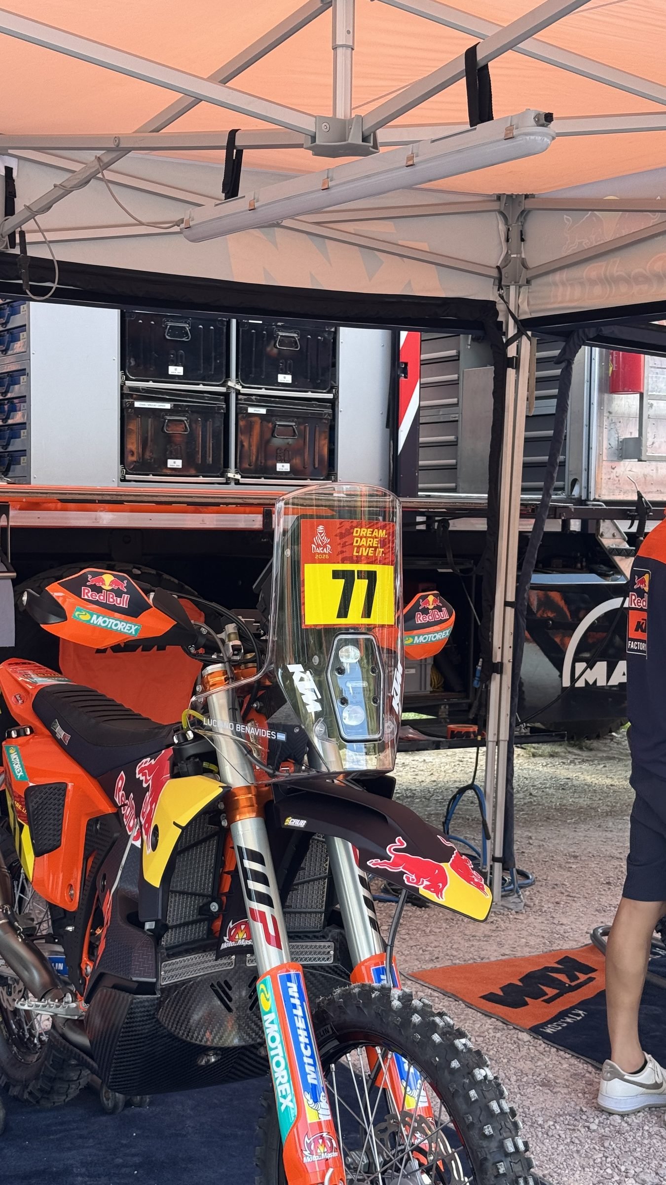 Factory KTM rally bike number 77 in the service tent