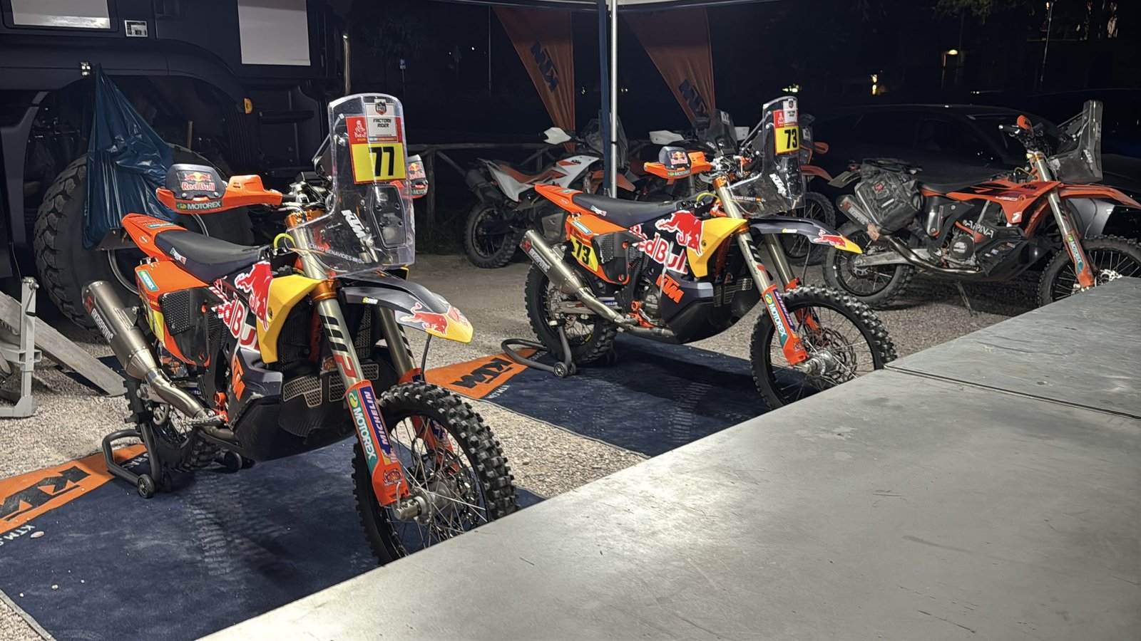 KTM factory rally bikes on display in the paddock tent, Gubbio