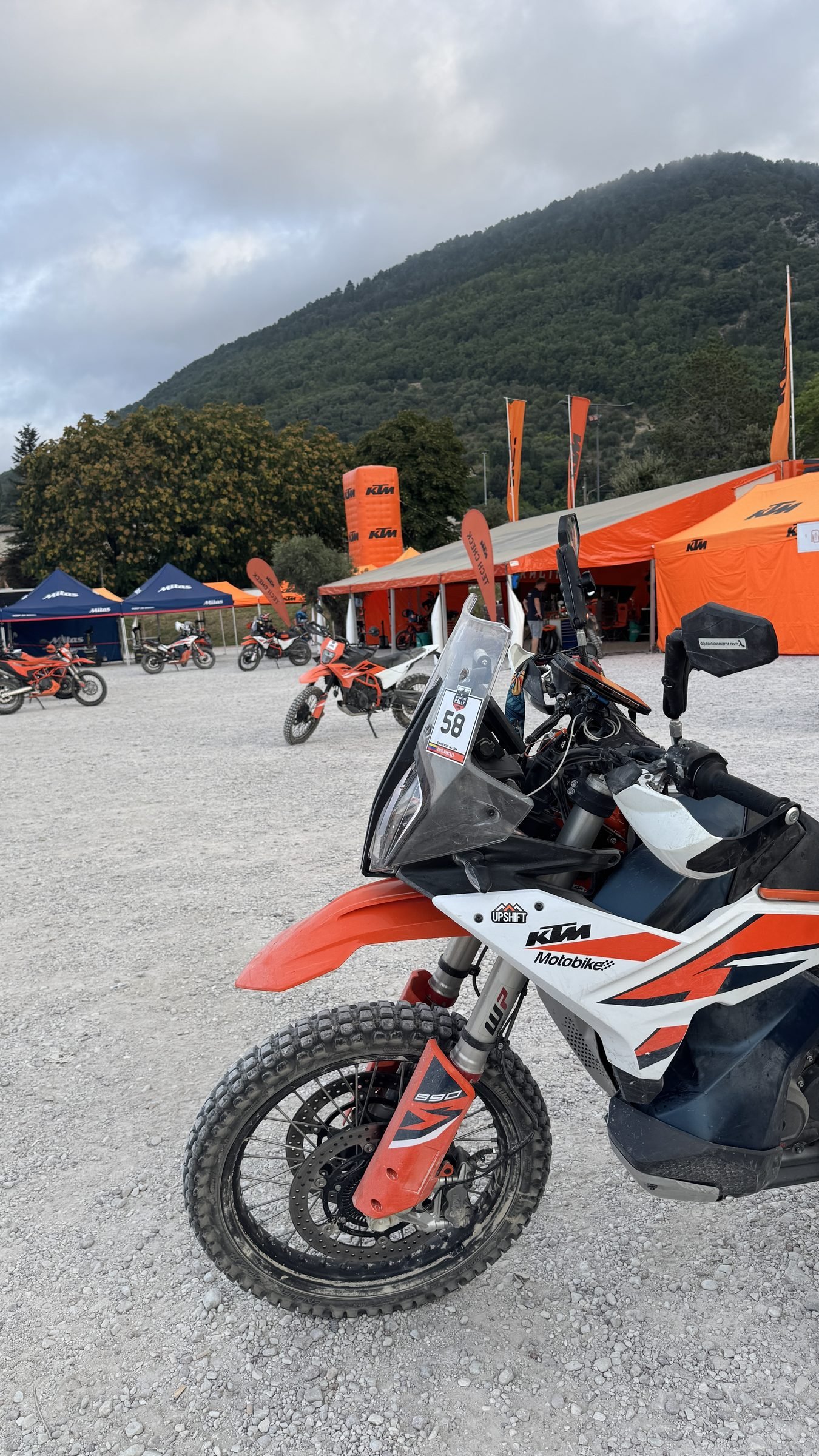 KTM adventure bike in the paddock among the orange KTM tents, Gubbio