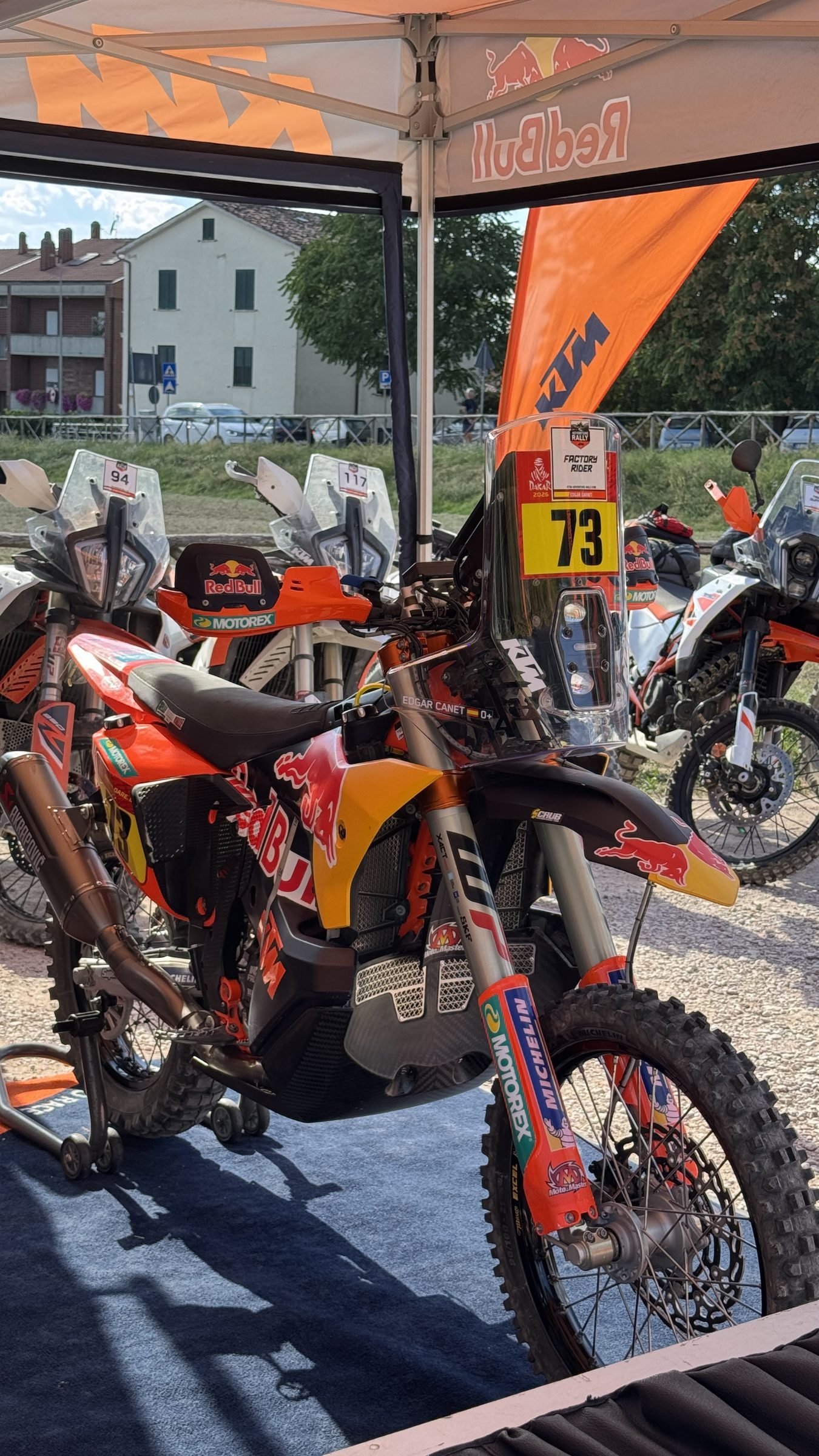 Factory KTM rally bike number 73 in the paddock