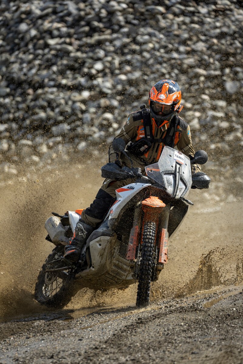 KTM 890 Adventure R throwing a gravel roost on the trail
