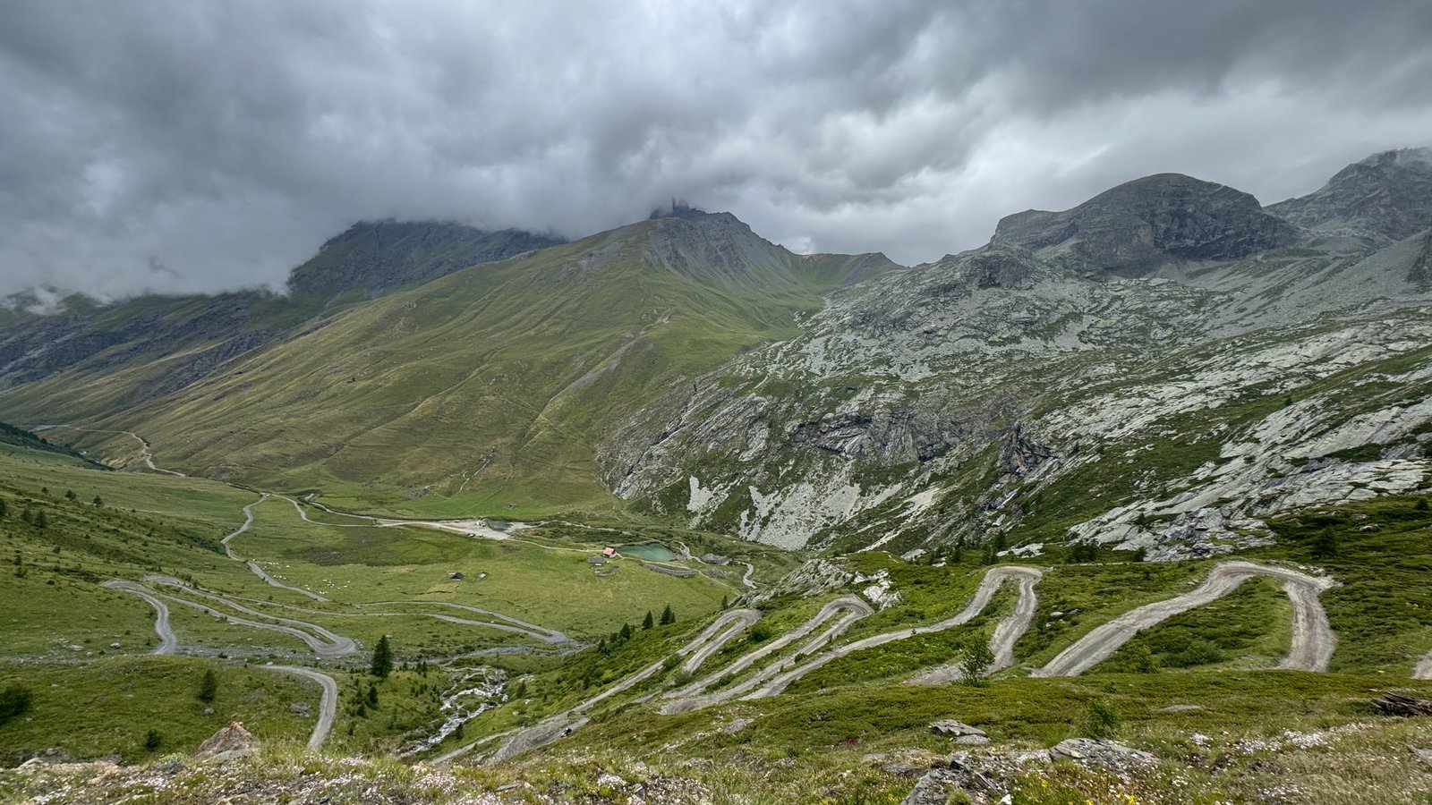 Alpine pass winding road mountain valley ride
