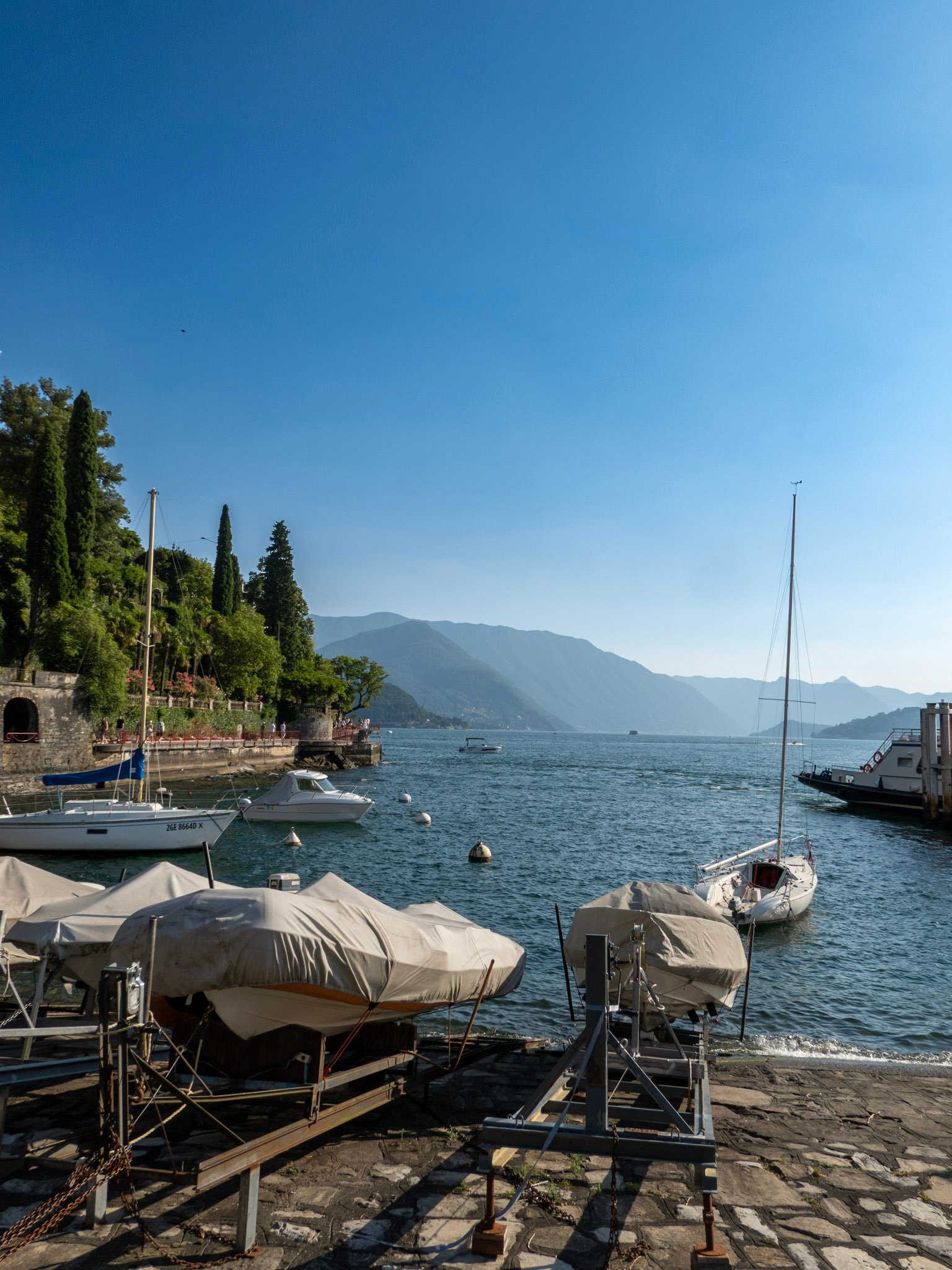 Lake Como panoramic — mountains and water in summer heat