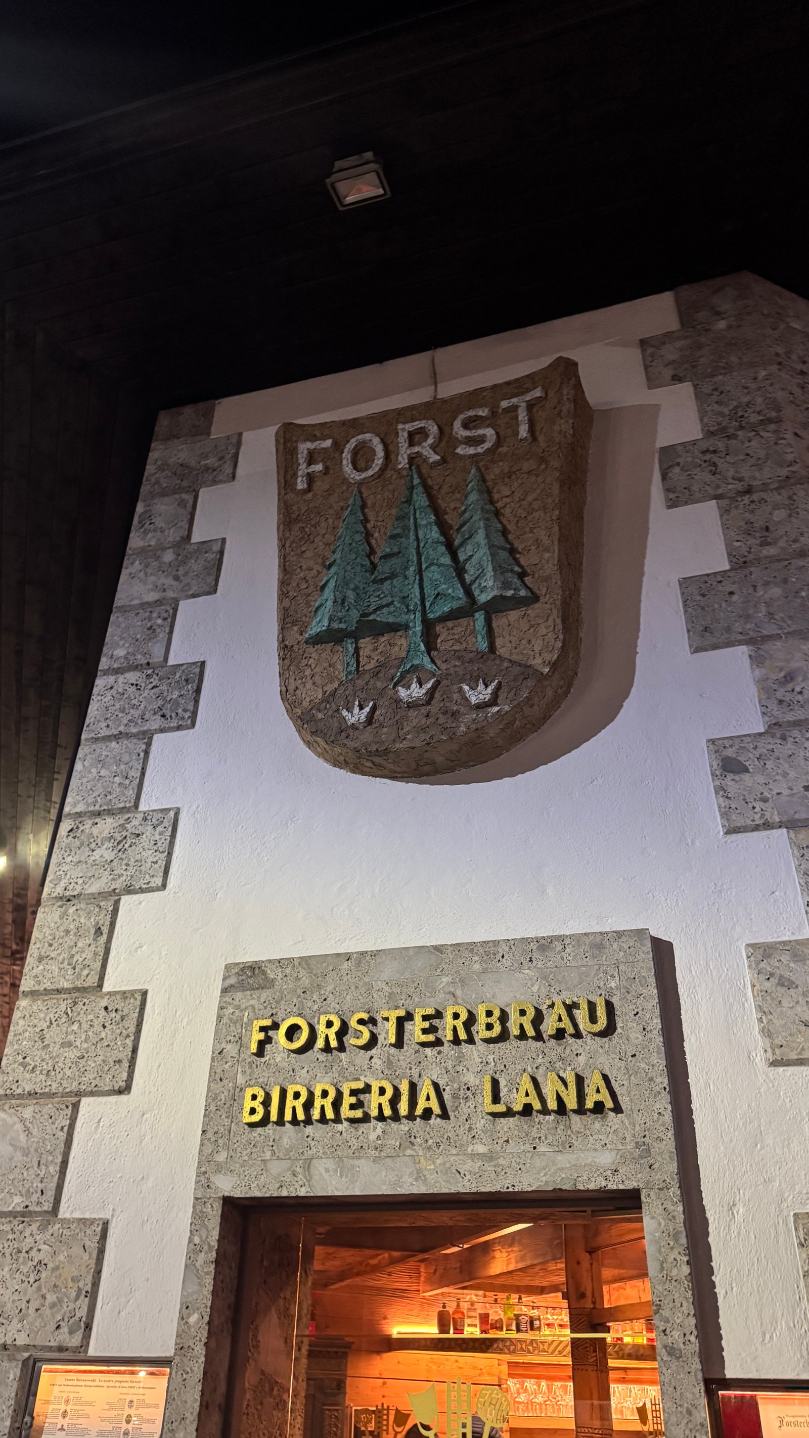 Forsterbräu Birreria Lana entrance with FORST shield sign, South Tyrol