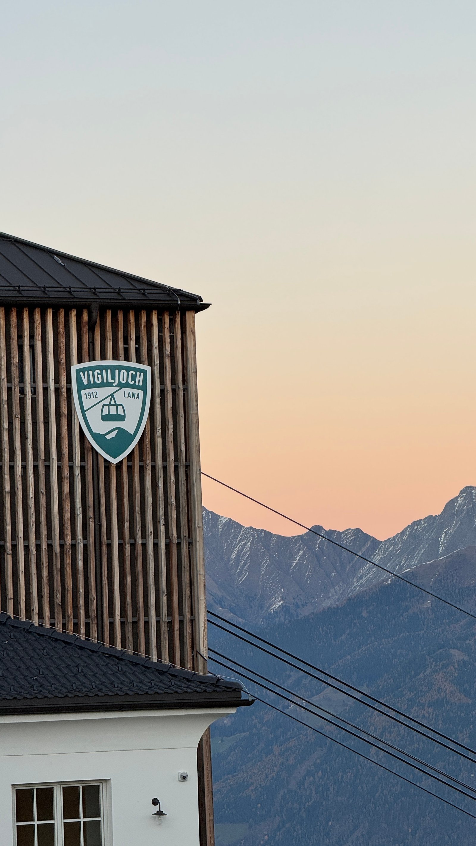 Vigiljoch 1912 Lana cable car station at sunset with Alps, South Tyrol