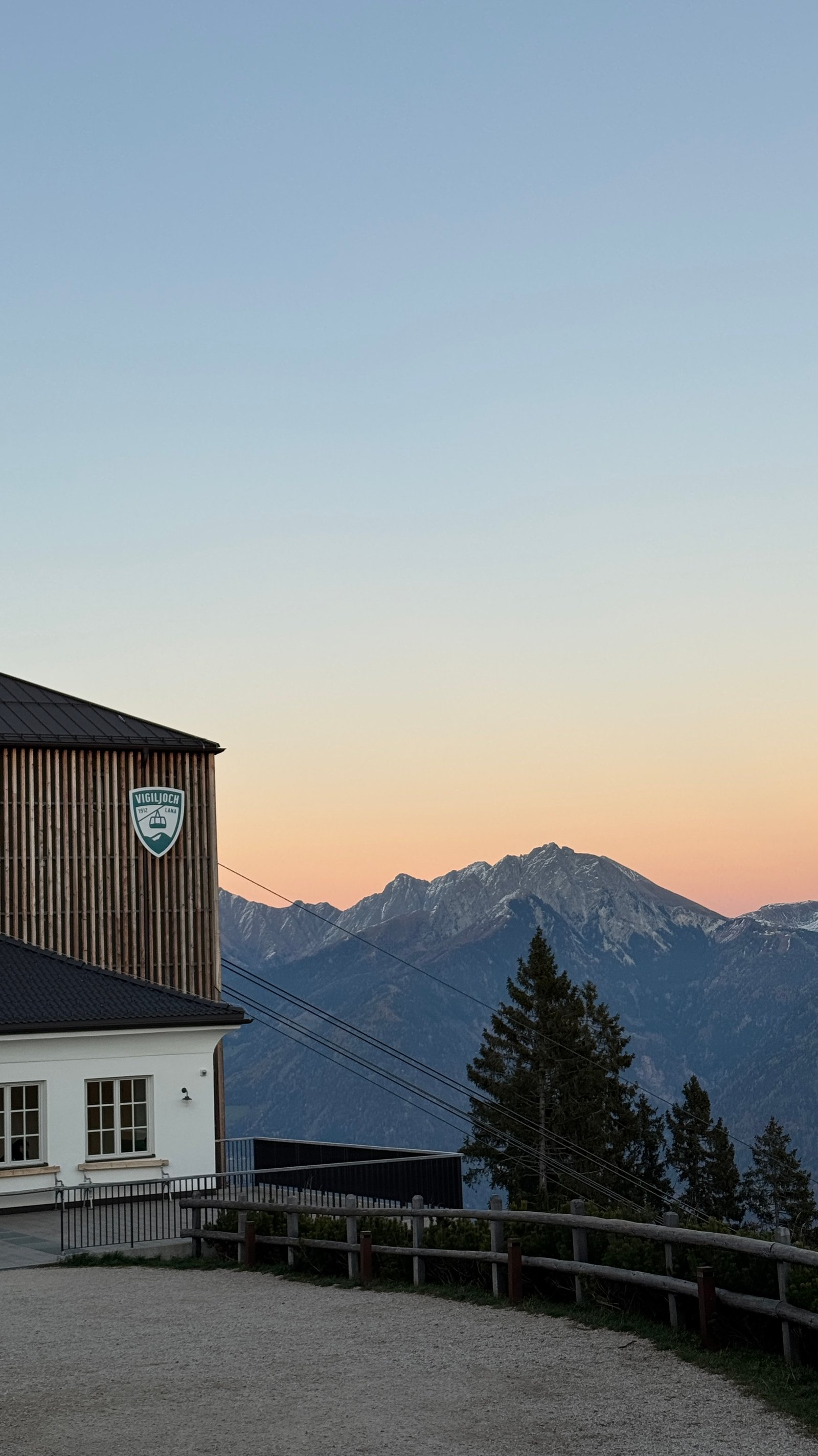 Vigiljoch cable car station at orange sunset, South Tyrol mountains